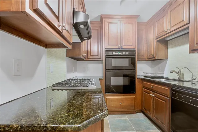 a view of backyard with deck and outdoor seating