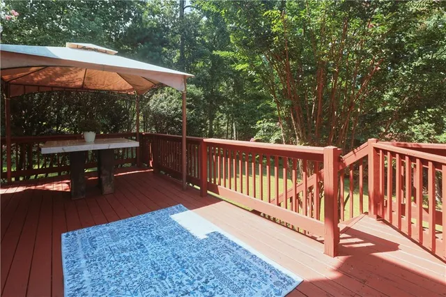 an aerial view of a house with a yard and outdoor seating