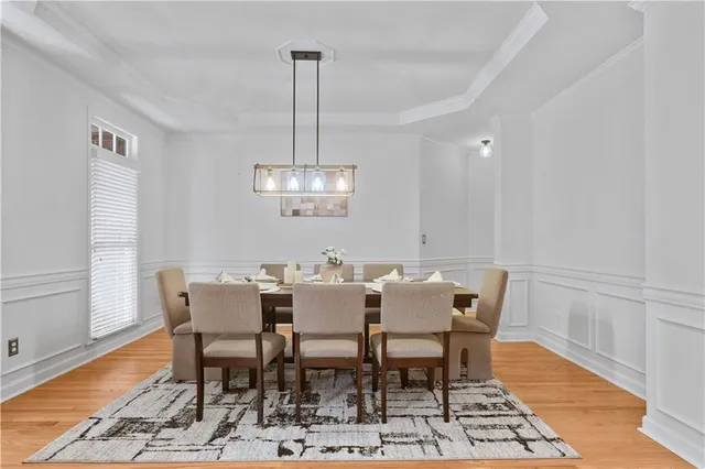 a view of a dining room with furniture and wooden floor