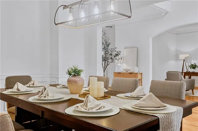 a view of living room with furniture and wooden floor