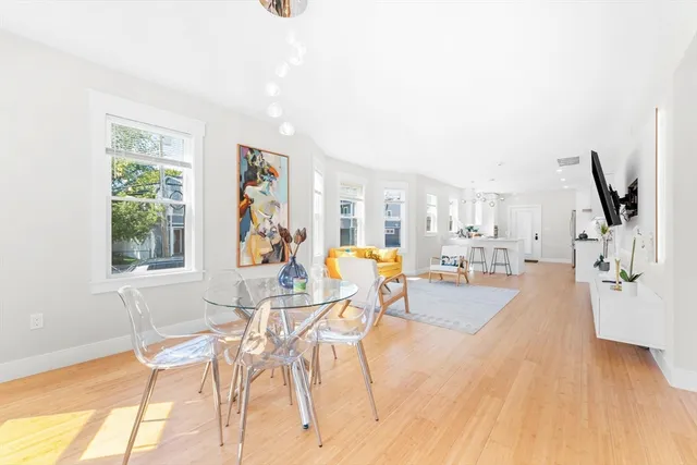 a view of a living room and dining room