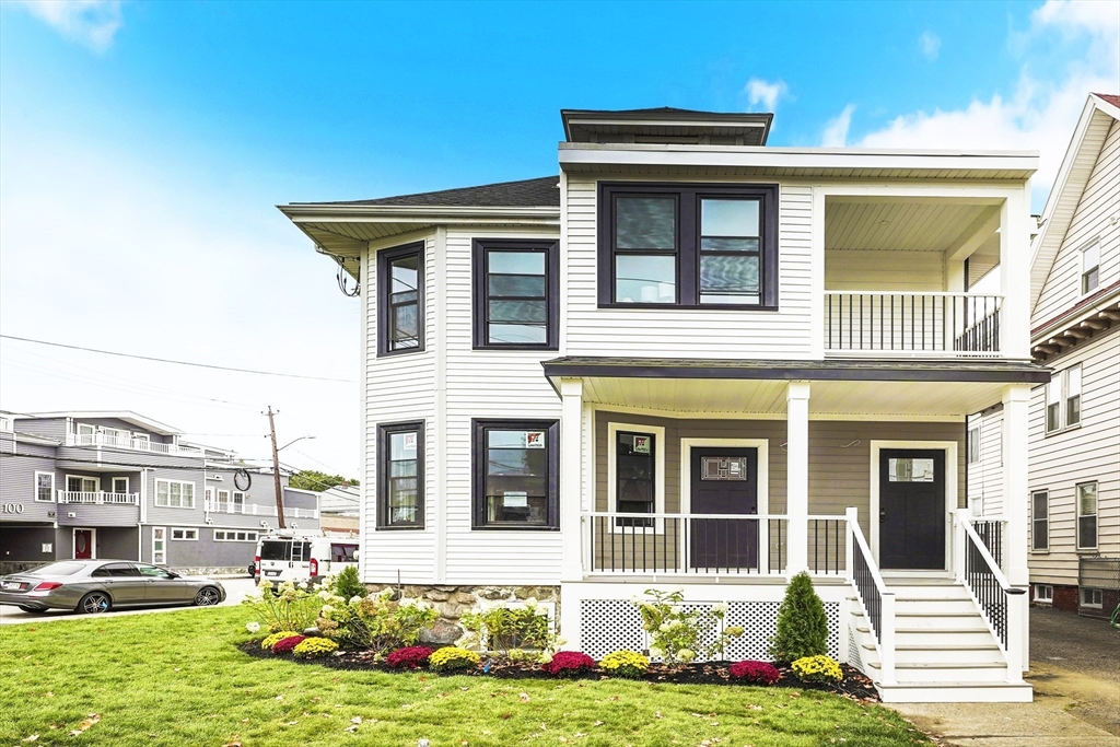 86 Cypress Street, Unit 86 Watertown, MA 02472 - Photo 2 of 38 a front view of a house with a yard