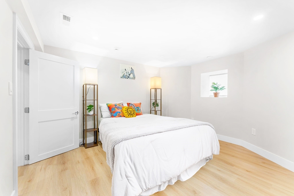 86 Cypress Street, Unit 86 Watertown, MA 02472 - Photo 28 of 38 a bedroom with a bed and a cabinets