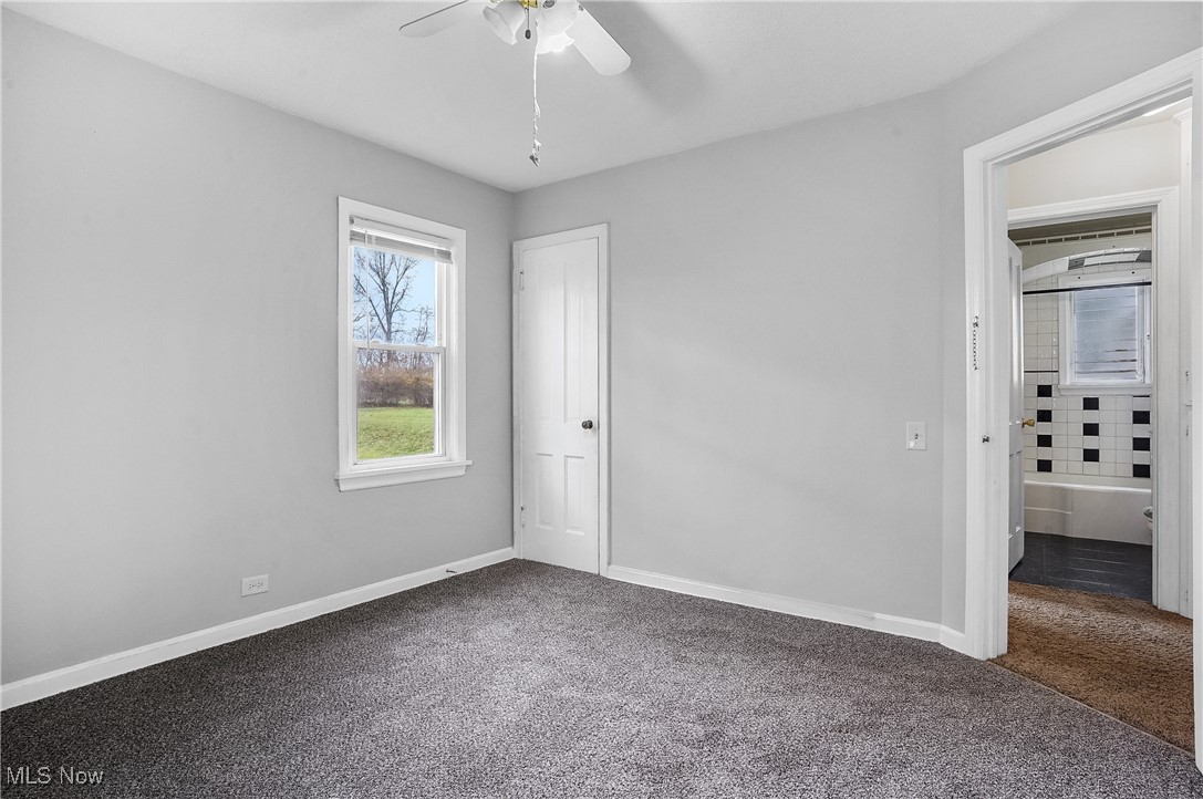 3206 9th Street Northwest Canton, OH 44708 - Photo 20 of 32 Unfurnished bedroom with carpet and ceiling fan
