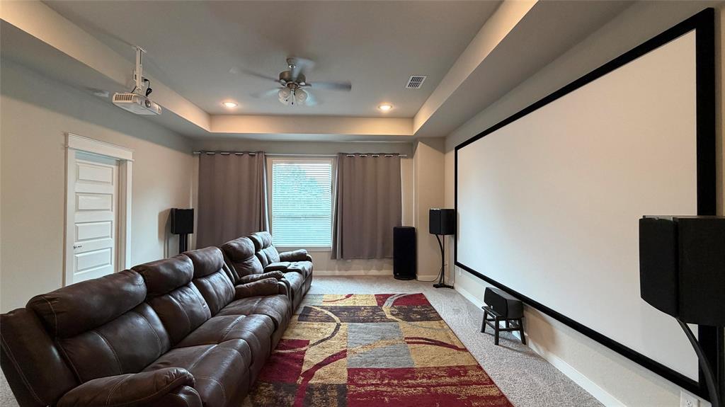 912 Fallbrook Avenue Denton, TX 76210 - Photo 17 of 26 a living room with furniture and a flat screen tv