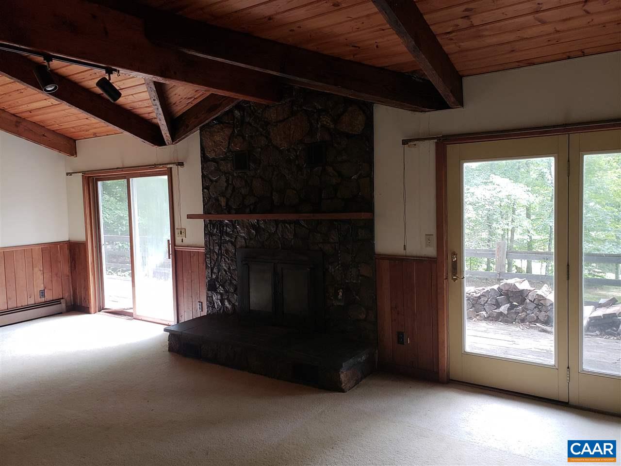680 Campbell Road Keswick, VA 22947 - Photo 3 of 19 a living room with furniture and a fireplace