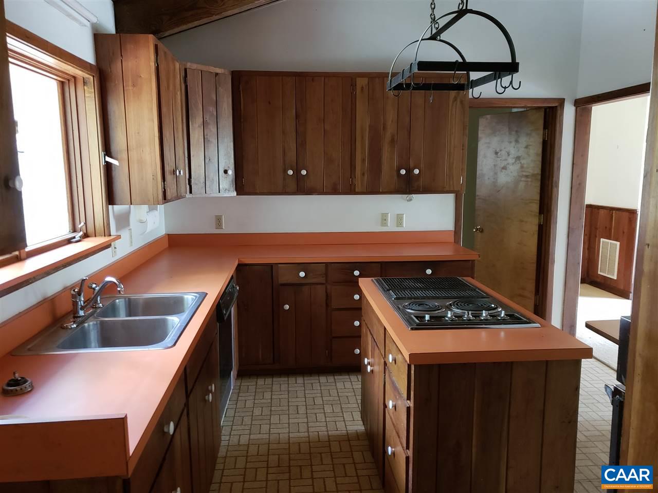 680 Campbell Road Keswick, VA 22947 - Photo 5 of 19 a kitchen with a sink a stove cabinets and a window