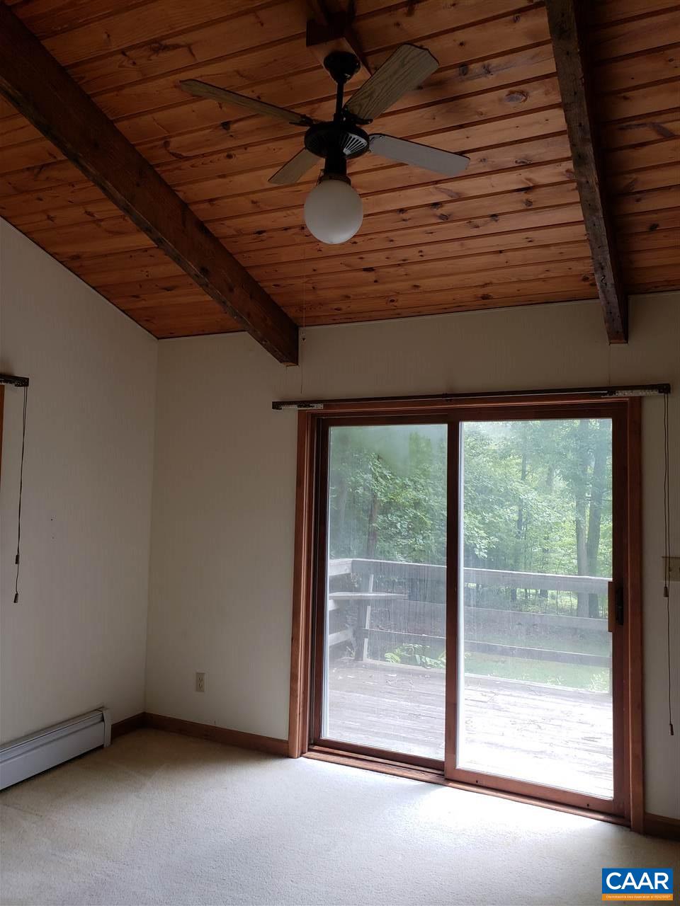 680 Campbell Road Keswick, VA 22947 - Photo 8 of 19 a view of room with window and ceiling fan