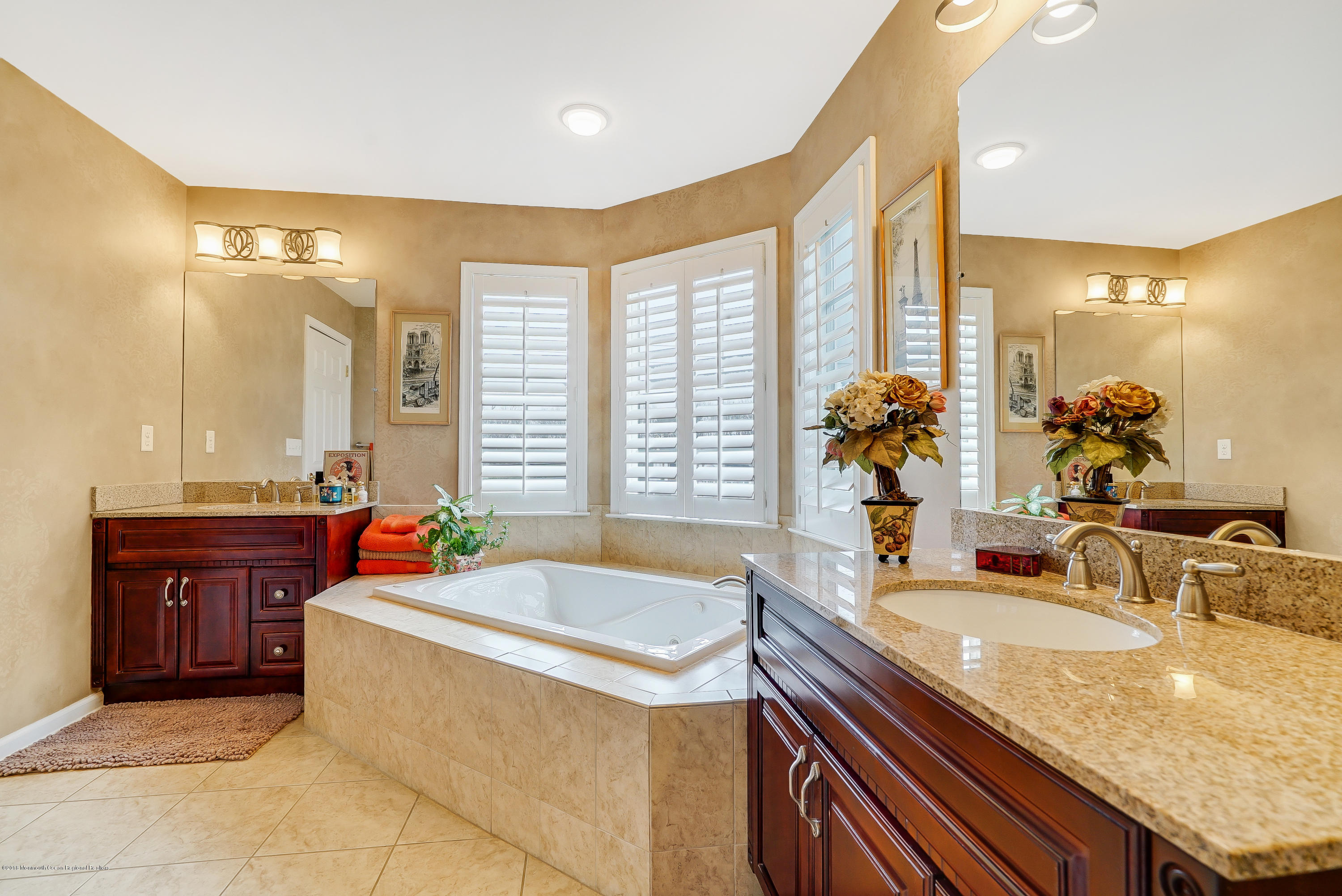 18 Mariners Bend Brielle, NJ 08730 - Photo 19 of 30 a bathroom with a granite countertop sink and a bathtub