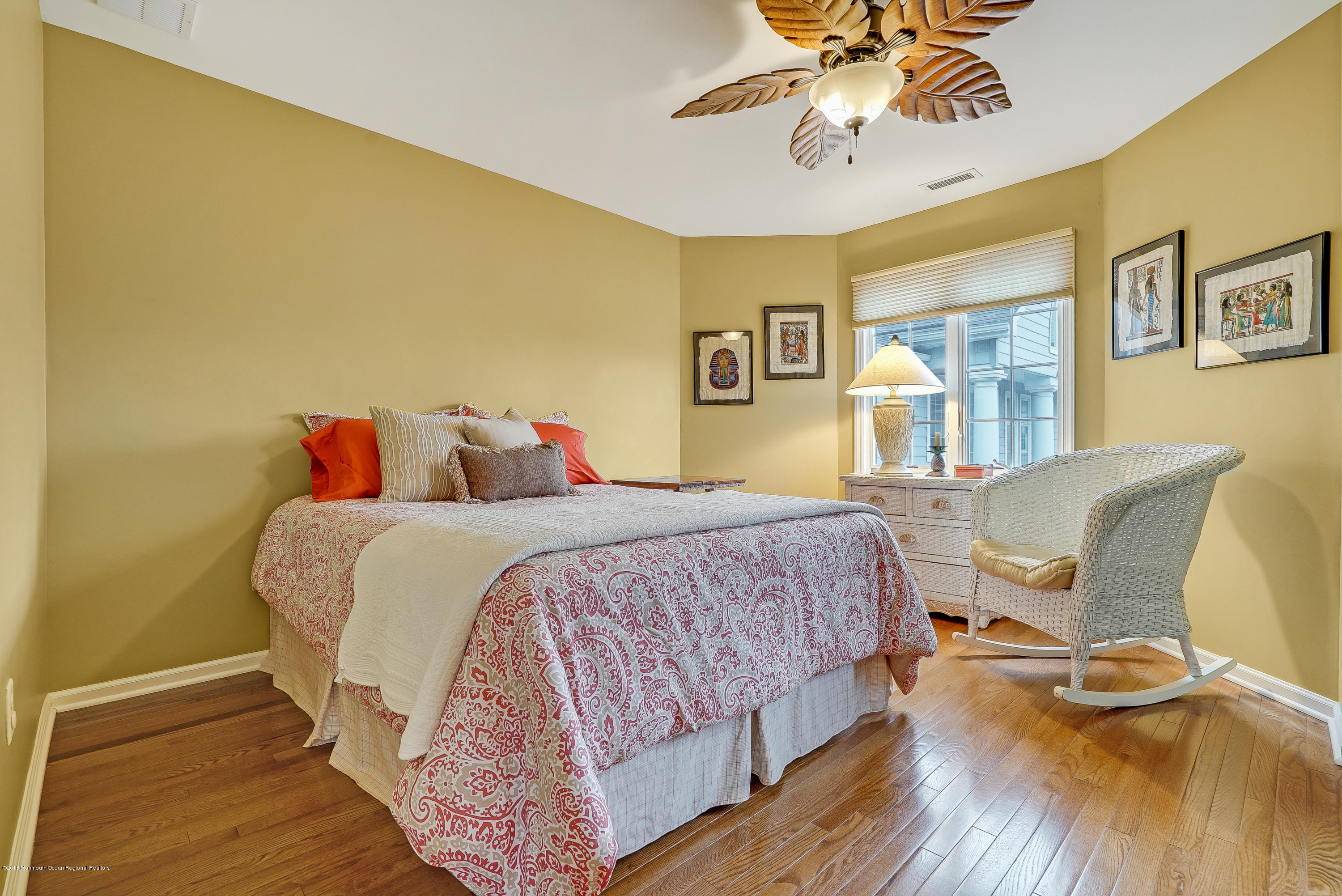 18 Mariners Bend Brielle, NJ 08730 - Photo 22 of 30 a bedroom with a bed and wooden floor