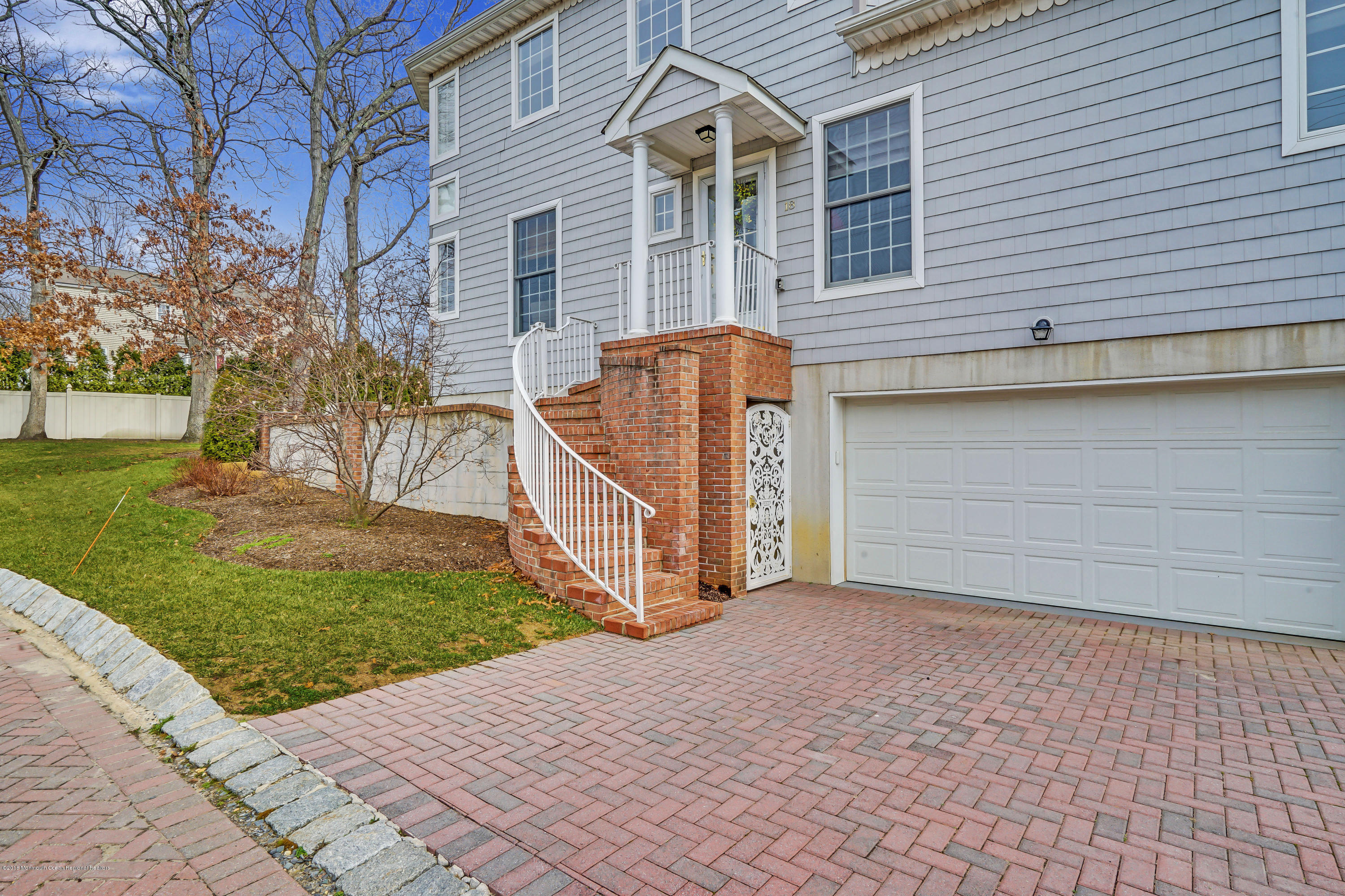 18 Mariners Bend Brielle, NJ 08730 - Photo 28 of 30 a view of a brick house with a yard