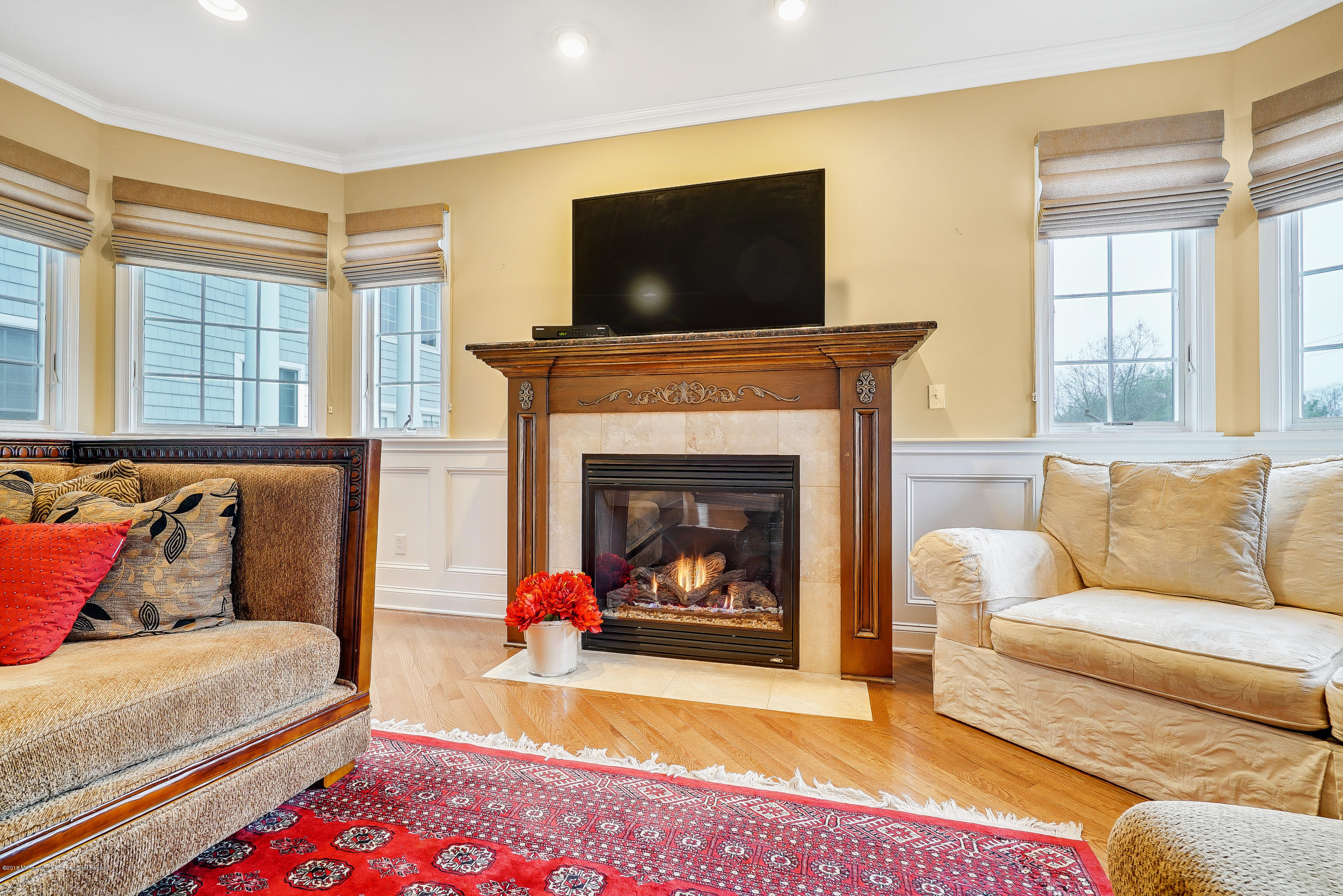 18 Mariners Bend Brielle, NJ 08730 - Photo 5 of 30 a living room with furniture and a fireplace
