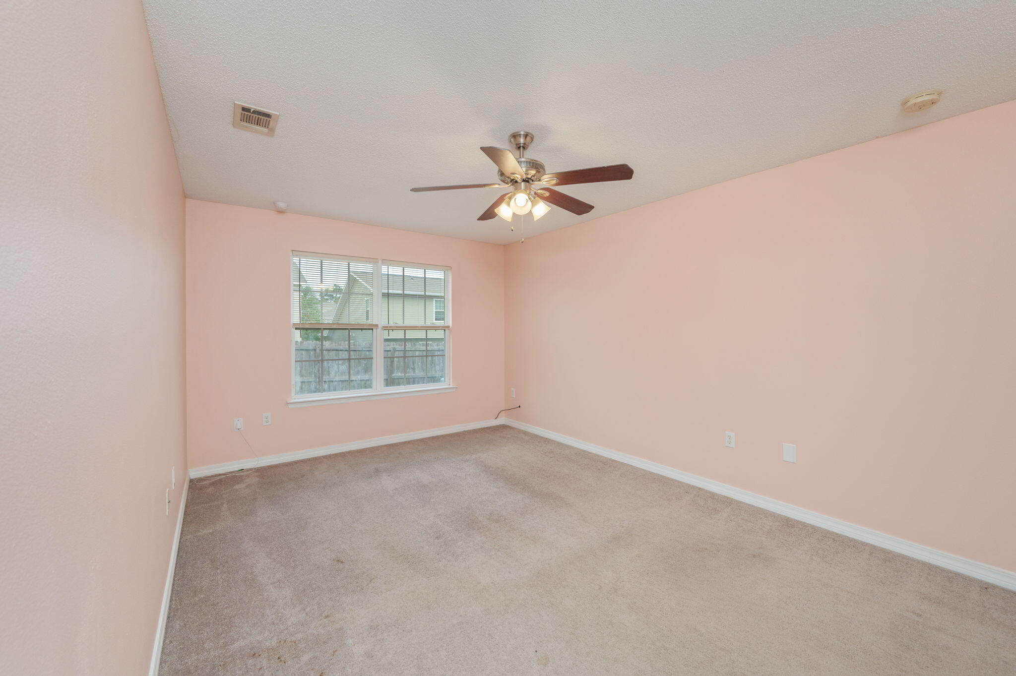 200 Wainwright Drive Crestview, FL 32539 - Photo 13 of 42 a view of a room with a ceiling fan and a window
