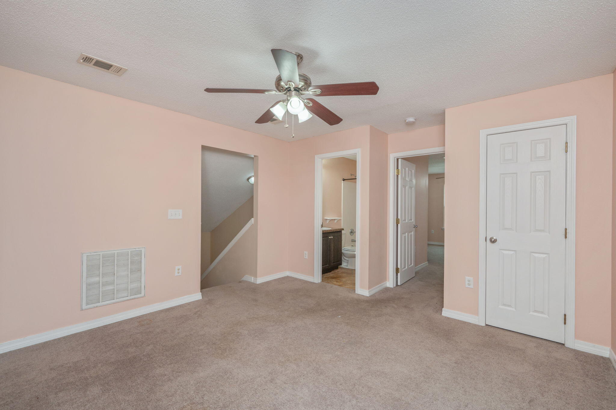 200 Wainwright Drive Crestview, FL 32539 - Photo 28 of 42 an empty room with closet and a ceiling fan