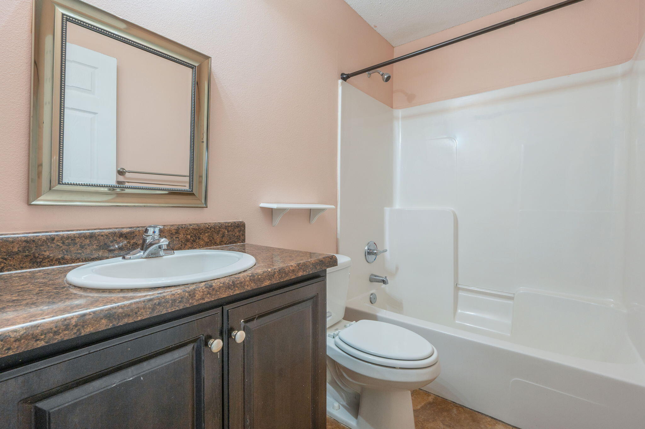 200 Wainwright Drive Crestview, FL 32539 - Photo 29 of 42 a bathroom with a sink a toilet and a mirror