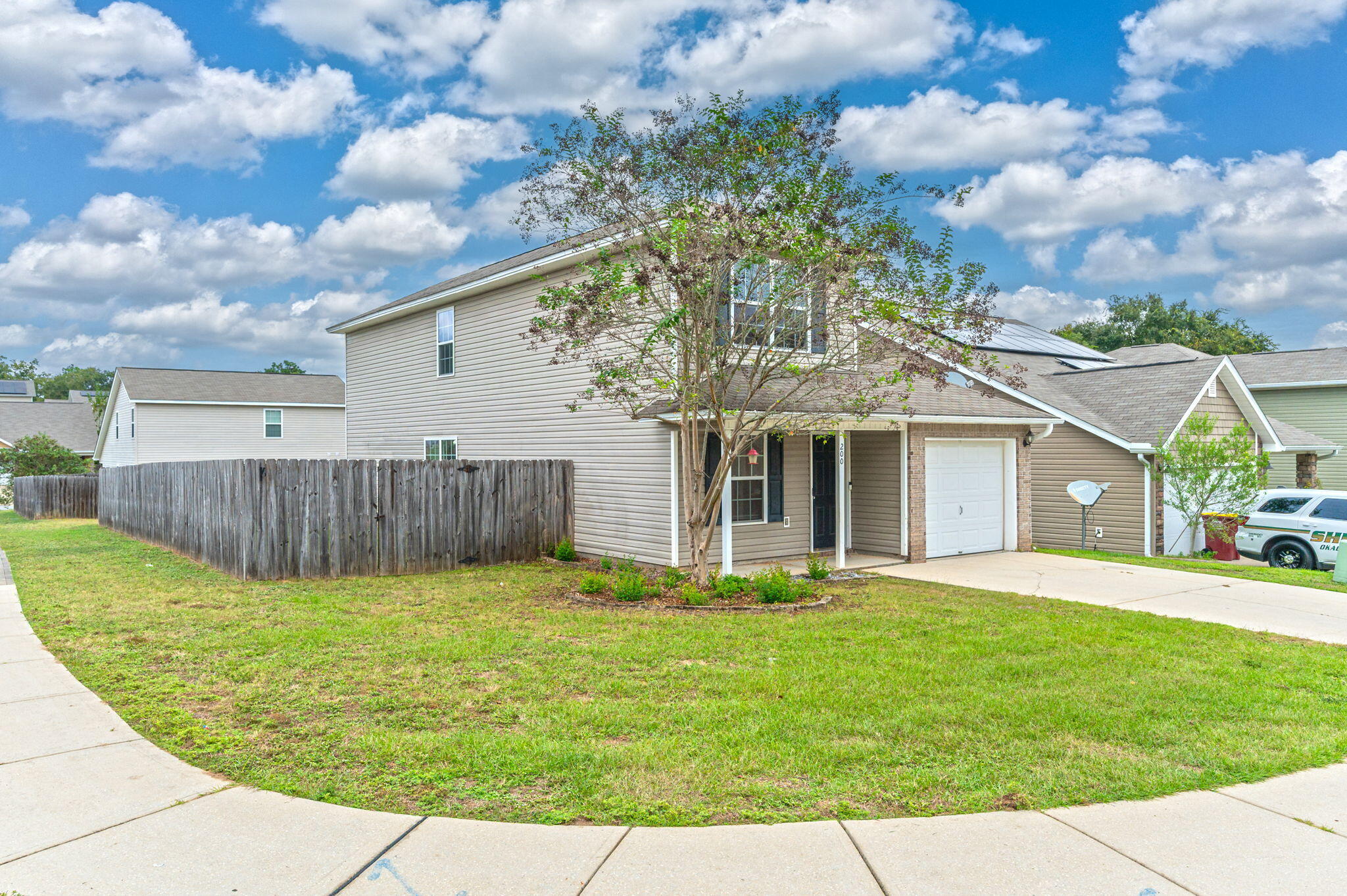 200 Wainwright Drive Crestview, FL 32539 - Photo 3 of 44 a front view of a house with a yard and trees
