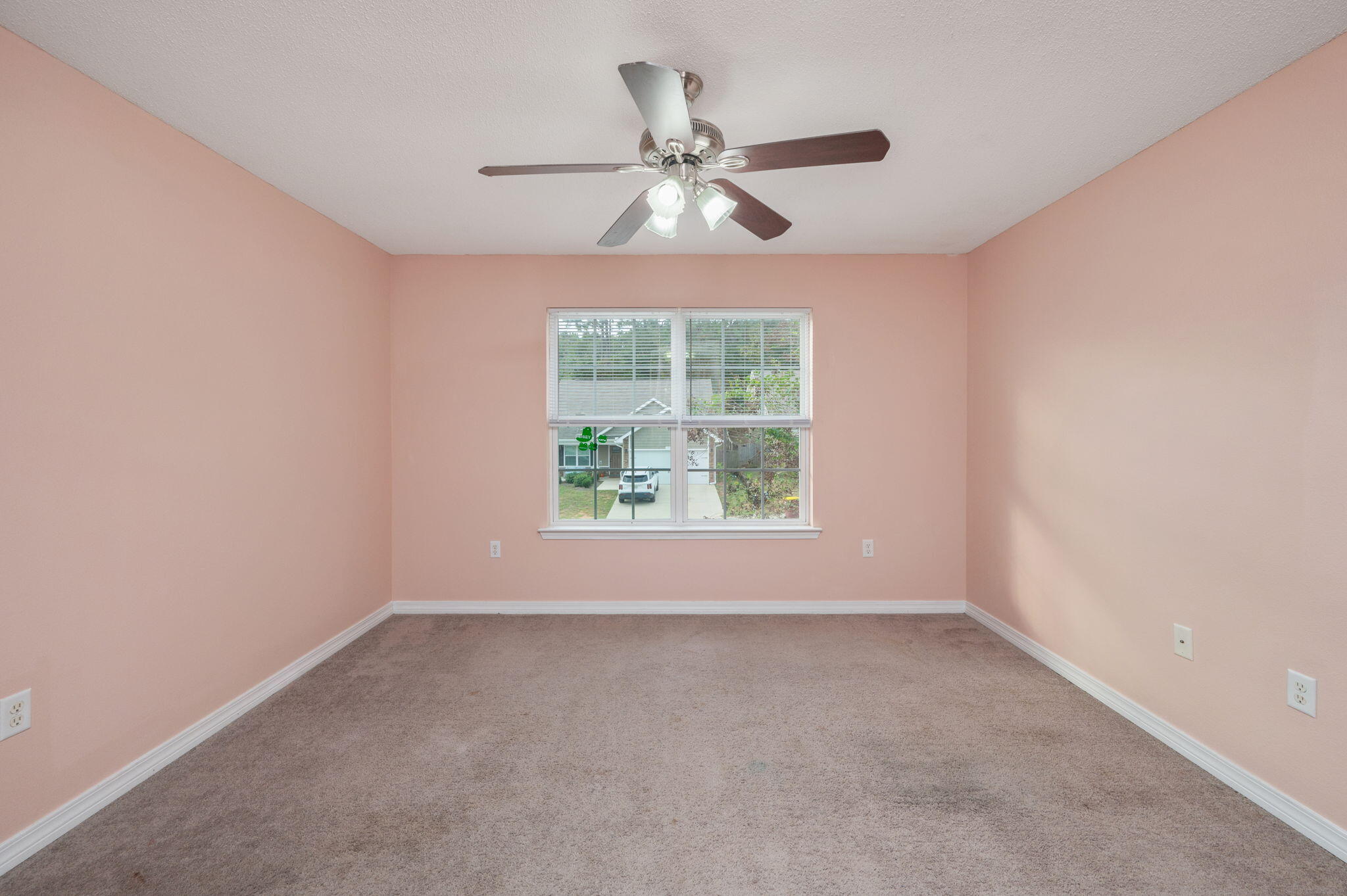 200 Wainwright Drive Crestview, FL 32539 - Photo 32 of 42 an empty room with a window and a ceiling fan