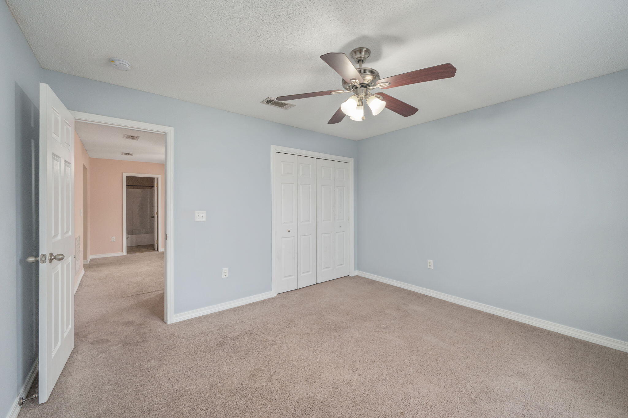 200 Wainwright Drive Crestview, FL 32539 - Photo 37 of 44 an empty room with a chandelier fan and closet