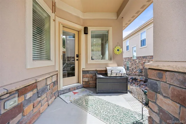a bathroom with a tub a sink and a large mirror next to a window