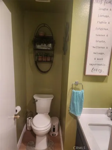 a bathroom with a toilet and a sink