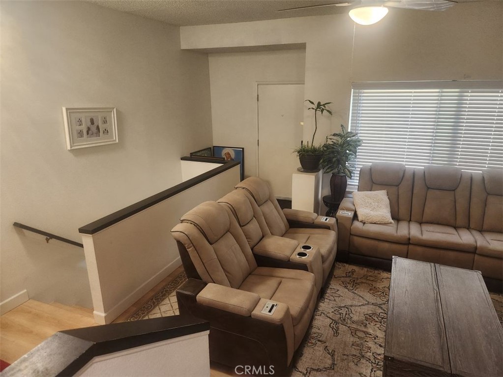 21730 Grace Avenue, Unit 2 Carson, CA 90745 - Photo 19 of 36 a living room with furniture and a window