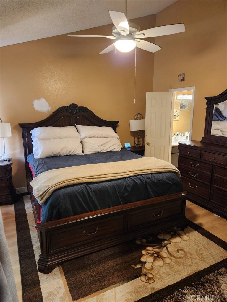 21730 Grace Avenue, Unit 2 Carson, CA 90745 - Photo 22 of 36 a bedroom with a bed and dresser with mirror