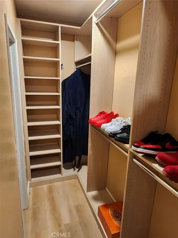 a room with storage and a white door