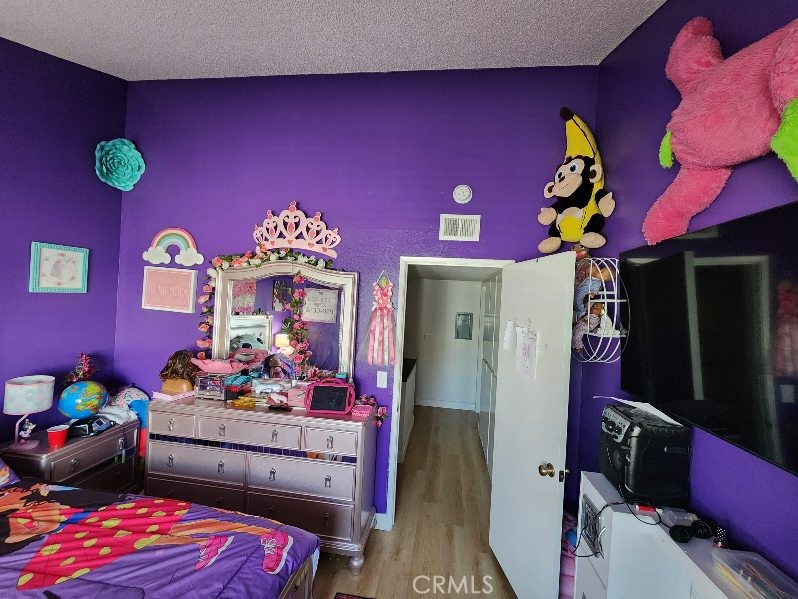 21730 Grace Avenue, Unit 2 Carson, CA 90745 - Photo 30 of 36 a bedroom with bed and a dresser