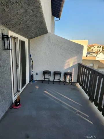 a view of a livingroom with furniture and staircase