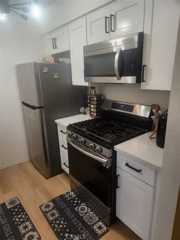 a kitchen with a stove and a microwave