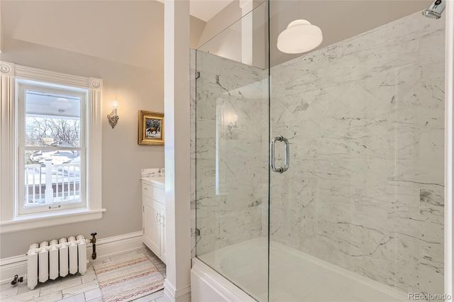 a bathroom with a bathtub and a shower