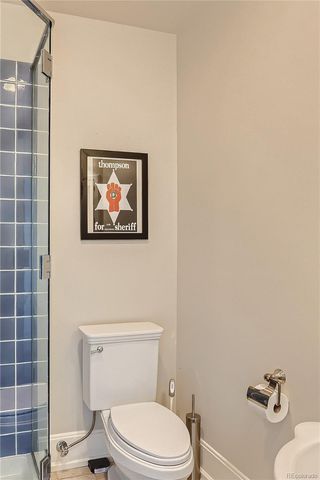 a white toilet sitting next to a bathroom sink