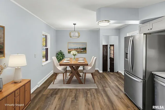a view of a dining room with furniture and wooden floor
