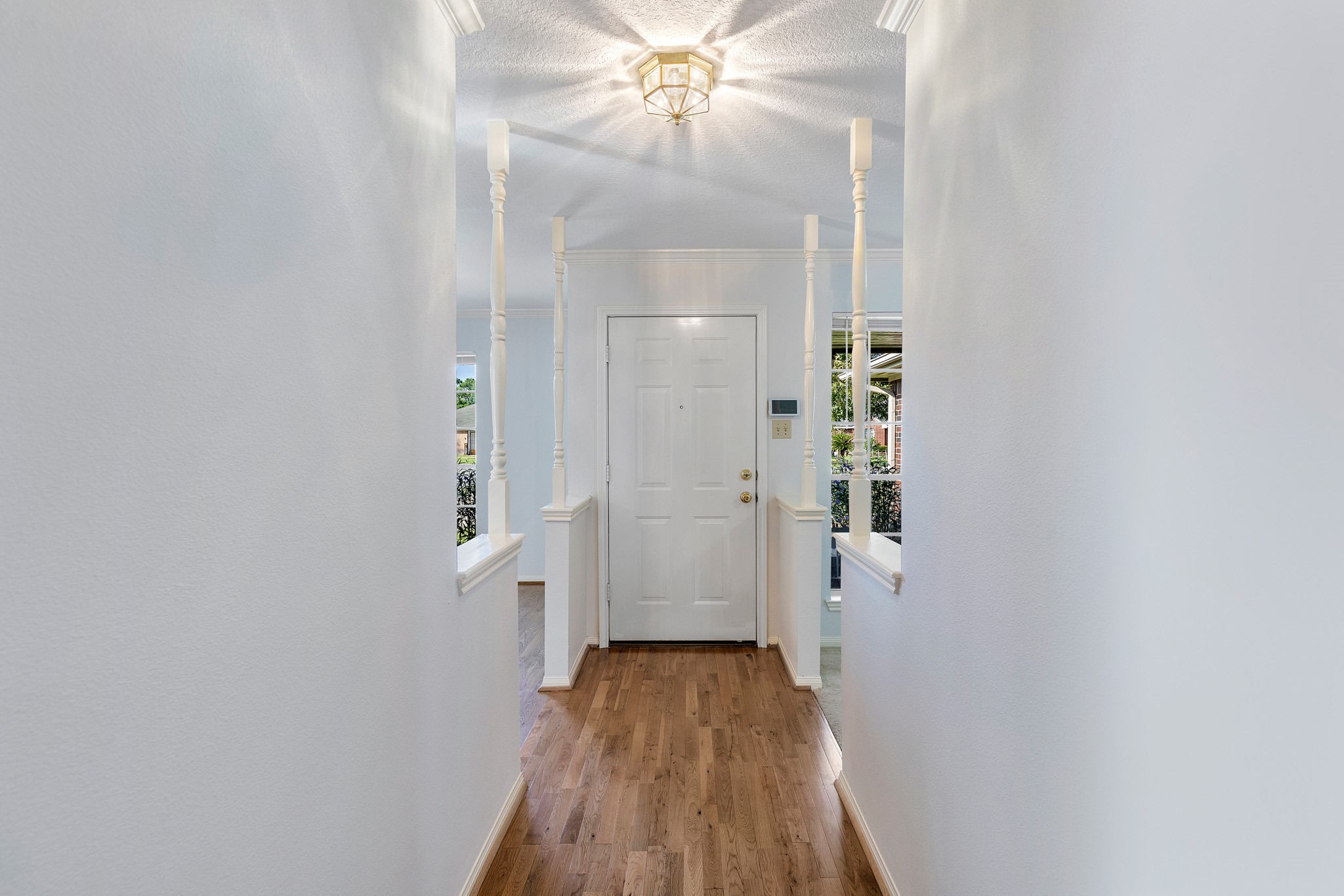 8018 Holiday Lane Houston, TX 77075 - Photo 6 of 42 a view of a hallway with wooden floor and staircase