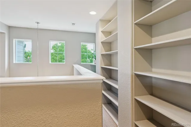 a white bath tub sitting in a room next to a window