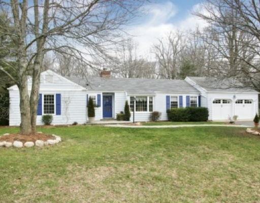 4 Libby Road Norwalk, CT 06850 - Photo 1 of 1 a front view of a house with a garden