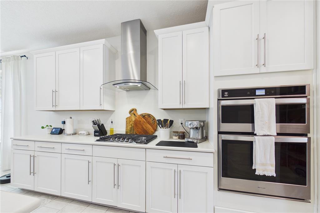 458 Convex Lane St. Augustine, FL 32095 - Photo 14 of 60 a kitchen with white cabinets and appliances