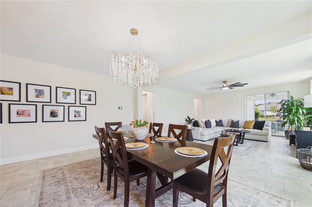 458 Convex Lane St. Augustine, FL 32095 - Photo 18 of 60 a view of a dining room with furniture and chandelier