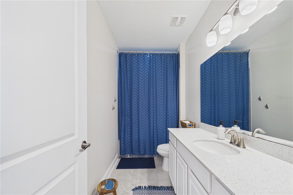 458 Convex Lane St. Augustine, FL 32095 - Photo 32 of 60 a bathroom with a sink a toilet and shower