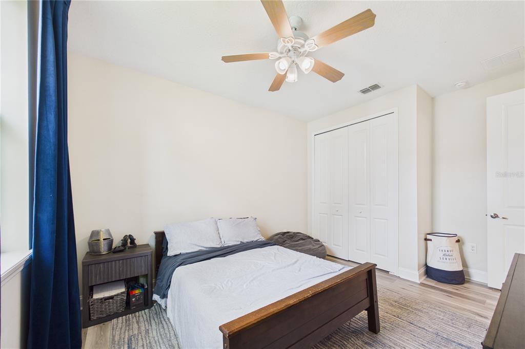 458 Convex Lane St. Augustine, FL 32095 - Photo 33 of 60 a bedroom with a bed and a chandelier