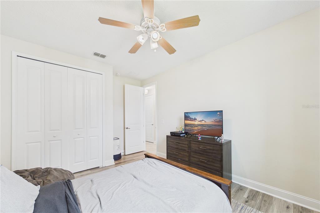 458 Convex Lane St. Augustine, FL 32095 - Photo 34 of 60 a bedroom with a bed and a flat screen tv
