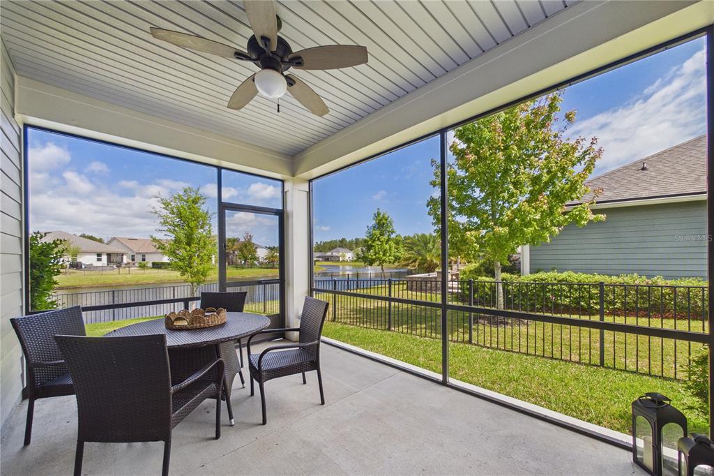 458 Convex Lane St. Augustine, FL 32095 - Photo 41 of 60 a view of a porch with furniture and a yard