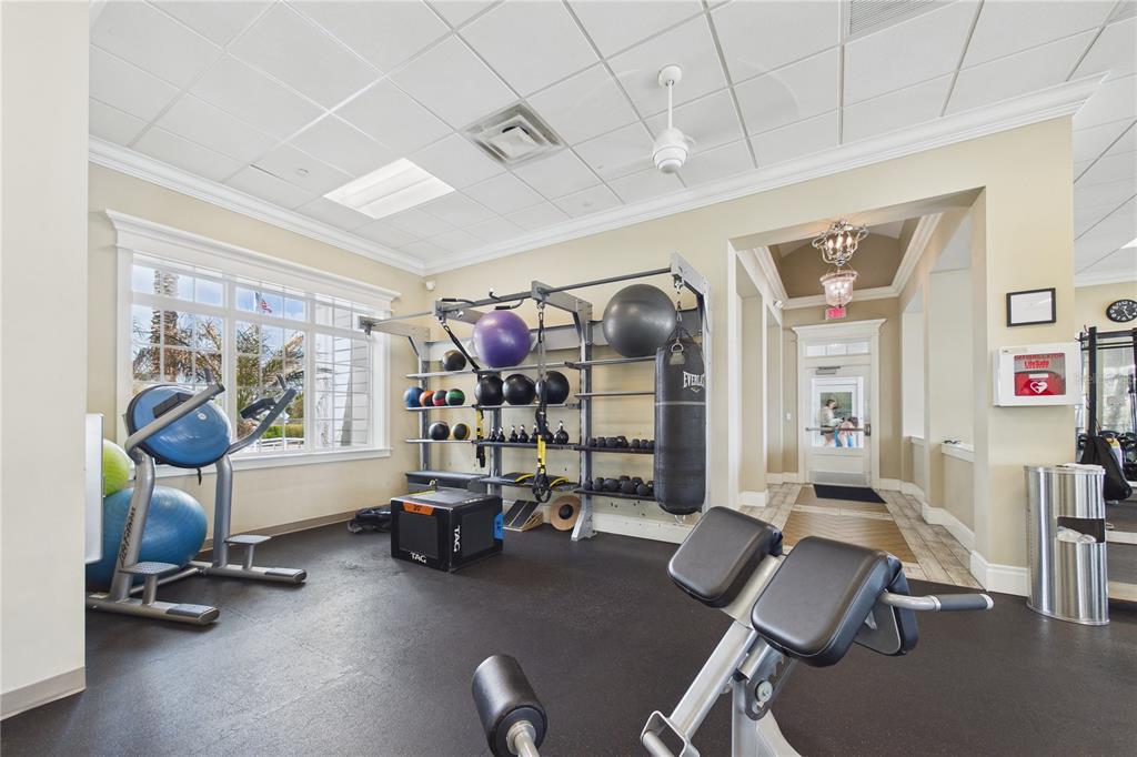 458 Convex Lane St. Augustine, FL 32095 - Photo 55 of 60 a room with gym equipment and a large window