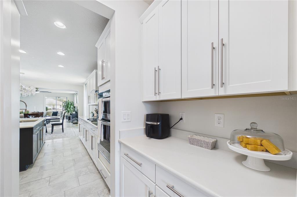 458 Convex Lane St. Augustine, FL 32095 - Photo 10 of 60 a kitchen with stainless steel appliances granite countertop a refrigerator and a stove