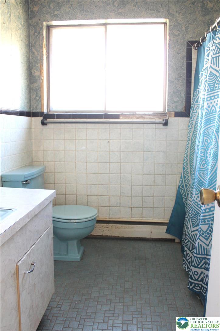 2465 Jacksonville Road Bethlehem, PA 18017 - Photo 16 of 28 a bathroom with a sink a toilet and window