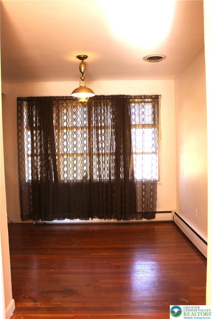 2465 Jacksonville Road Bethlehem, PA 18017 - Photo 5 of 28 an empty room with wooden floor and windows