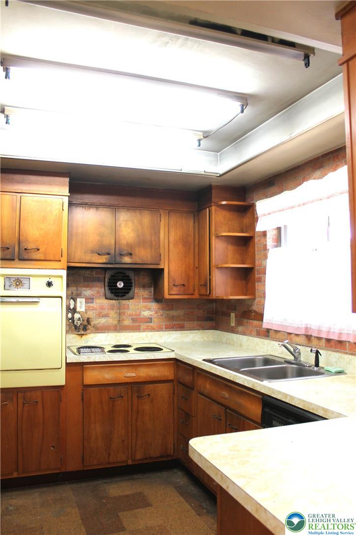 2465 Jacksonville Road Bethlehem, PA 18017 - Photo 8 of 28 a kitchen with stainless steel appliances granite countertop a sink and a stove