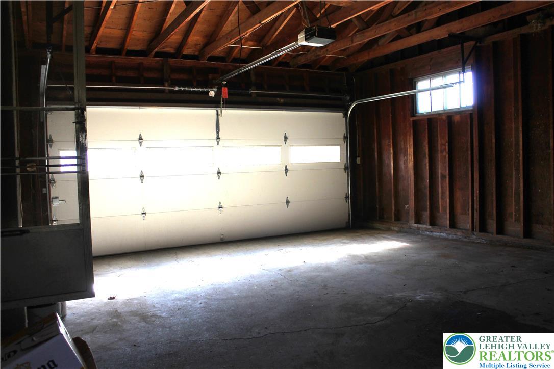 2465 Jacksonville Road Bethlehem, PA 18017 - Photo 9 of 28 a view of an empty room with wooden floor and a window