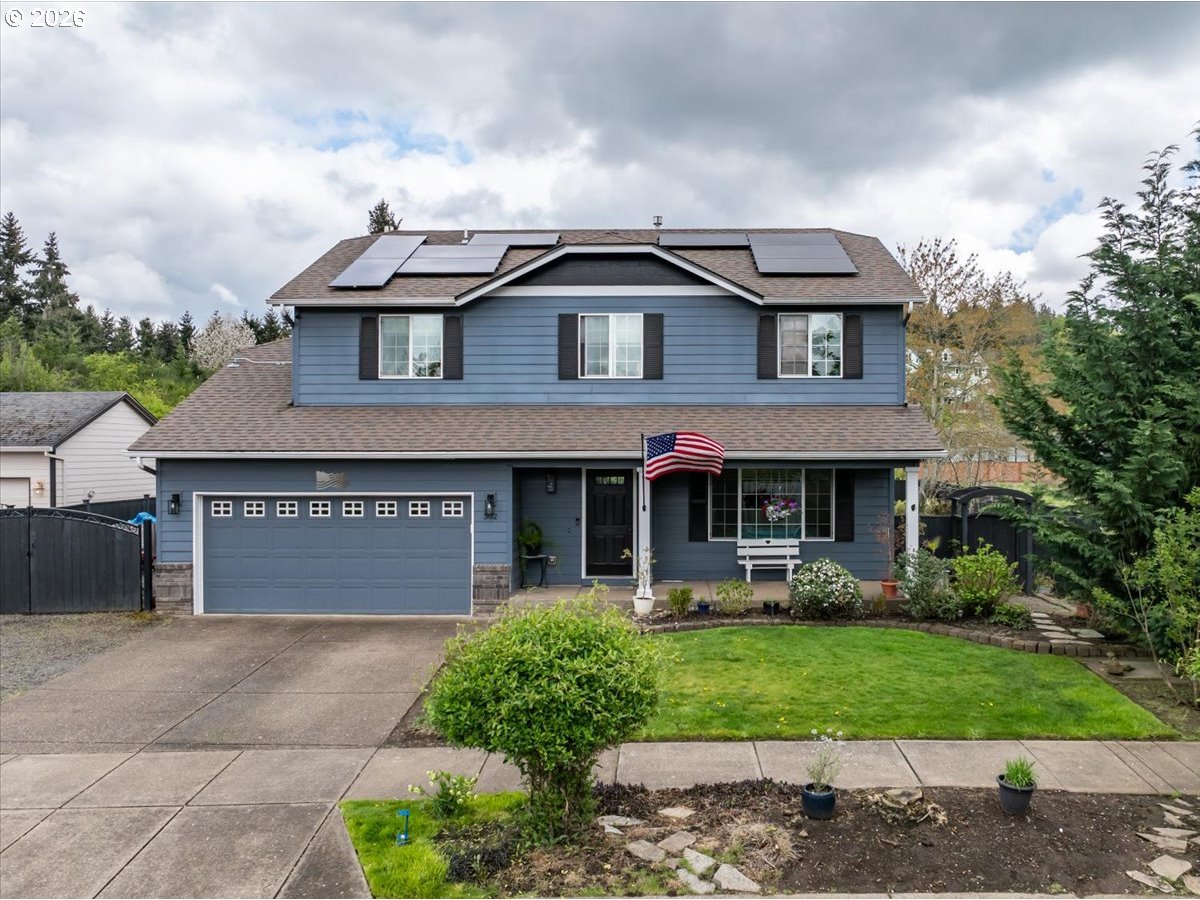 302 Division Street Northeast Silverton, OR 97381 - Photo 1 of 48 a front view of a house with garden