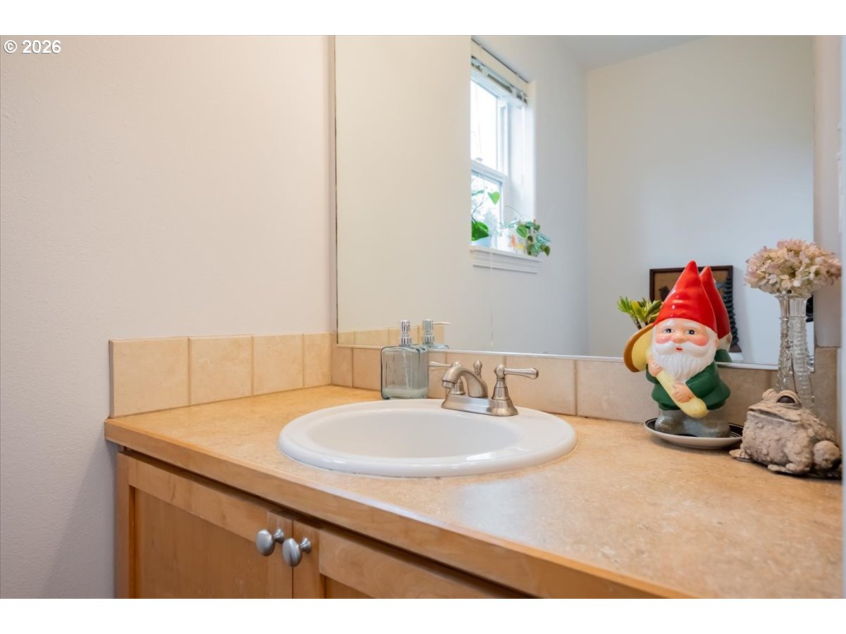 302 Division Street Northeast Silverton, OR 97381 - Photo 19 of 48 a bathroom with a sink and a mirror